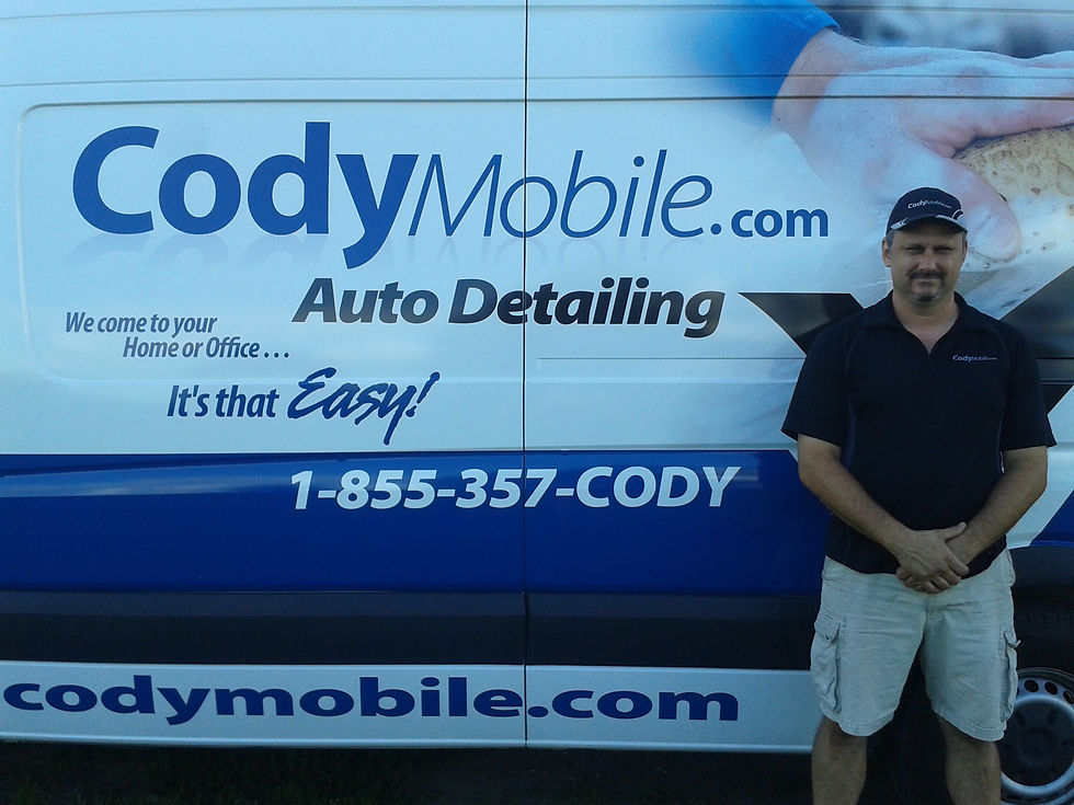 Brian standing beside his Cody Mobile Auto Detailing van
